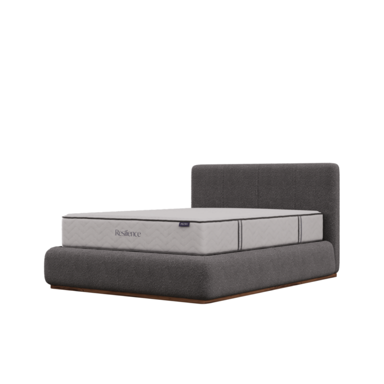 Corner view of a Resilience mattress on a bed frame